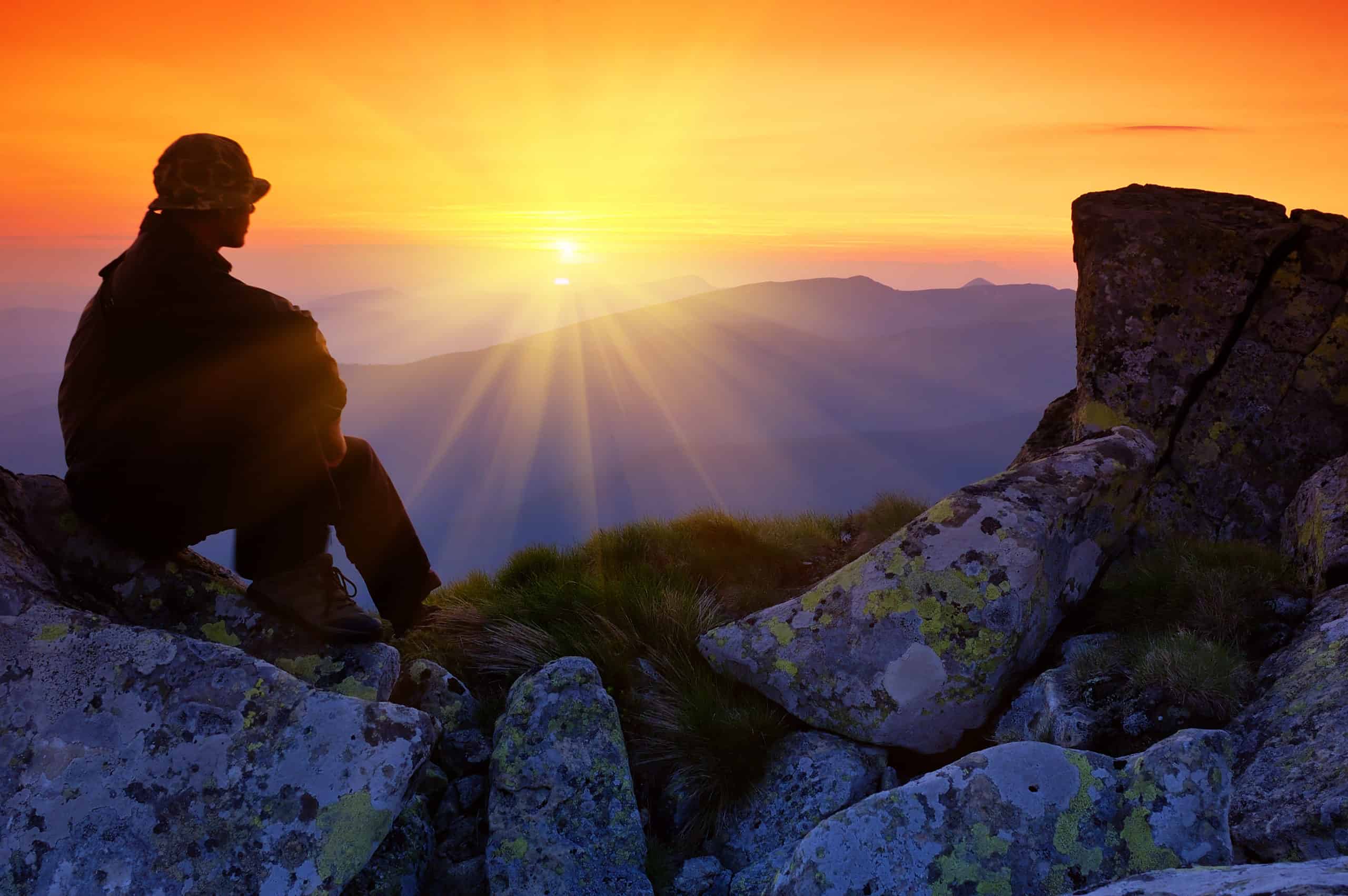 Man reflecting on his progress looking at the view over mountains after a lifestyle consult